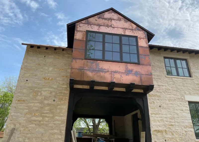 Copper metal panel facade on a stone building for Metal Roof Coating in Fillmore