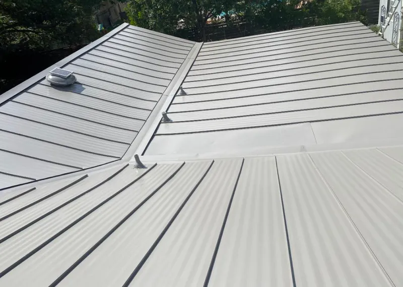 Solar attic fan installed on a metal roof for Roof Ventilation in Fillmore